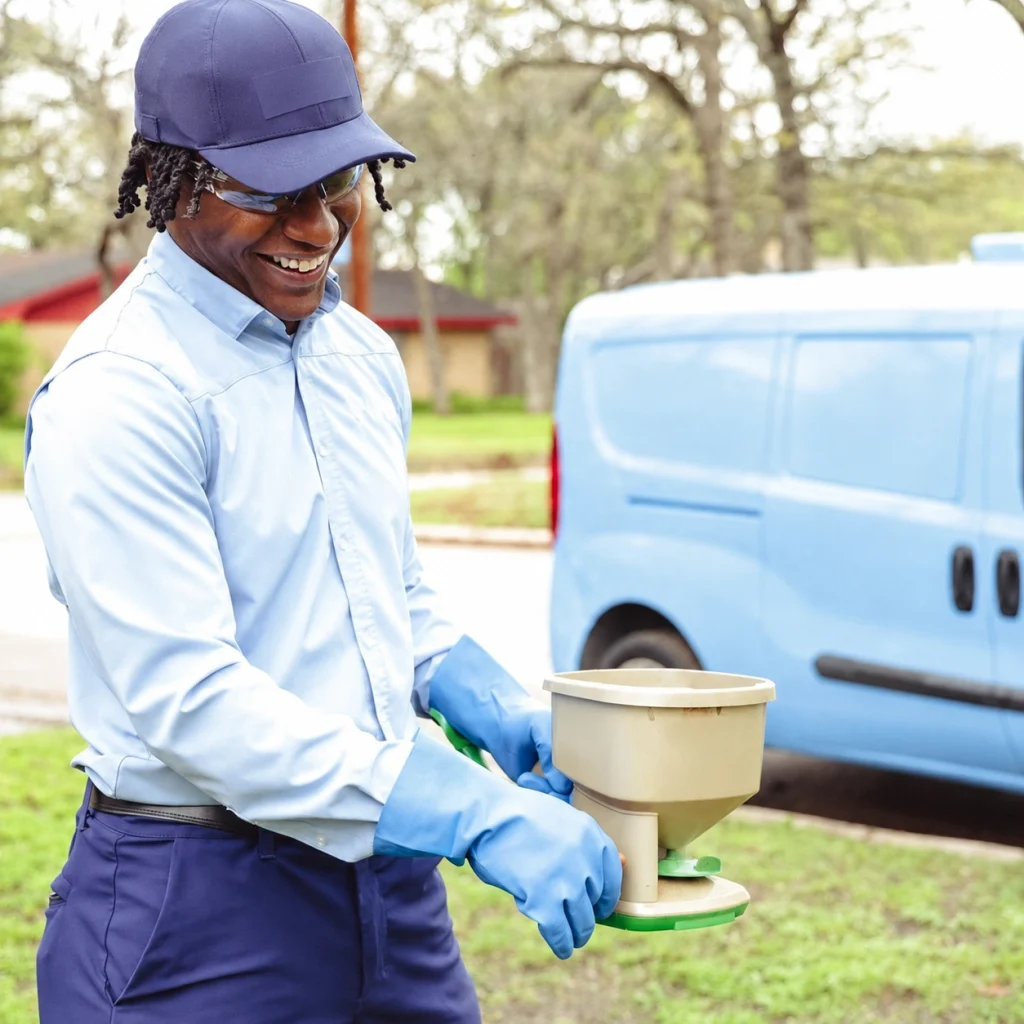 Technician treating a lawn in South Florida